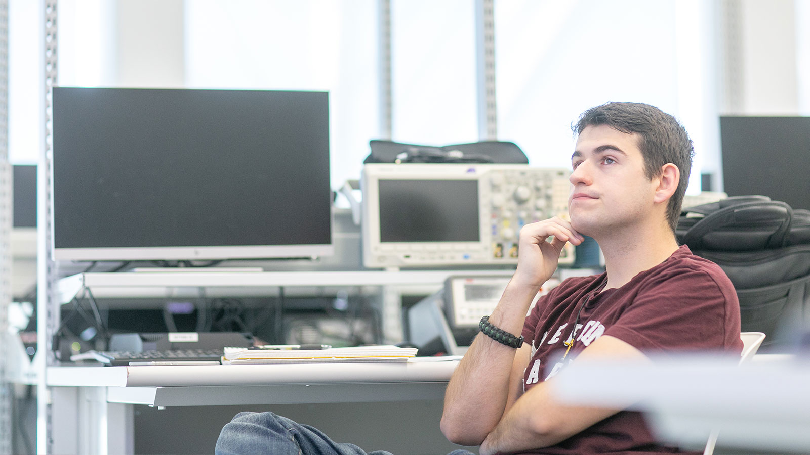 student listening in computer lab