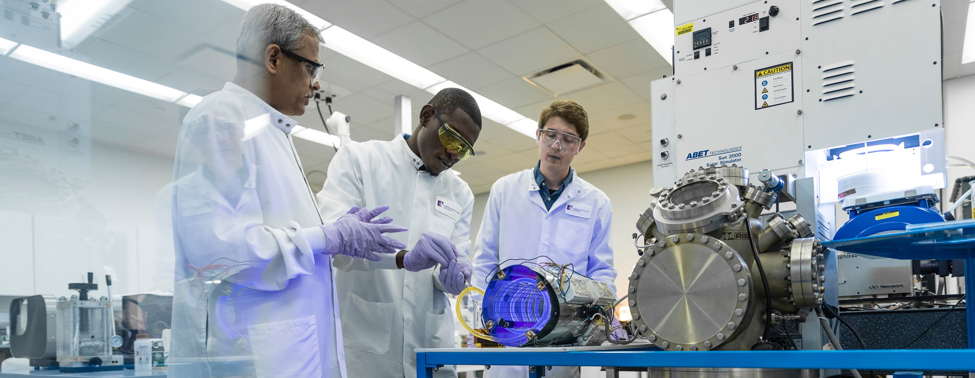 professor teaching students in a lab