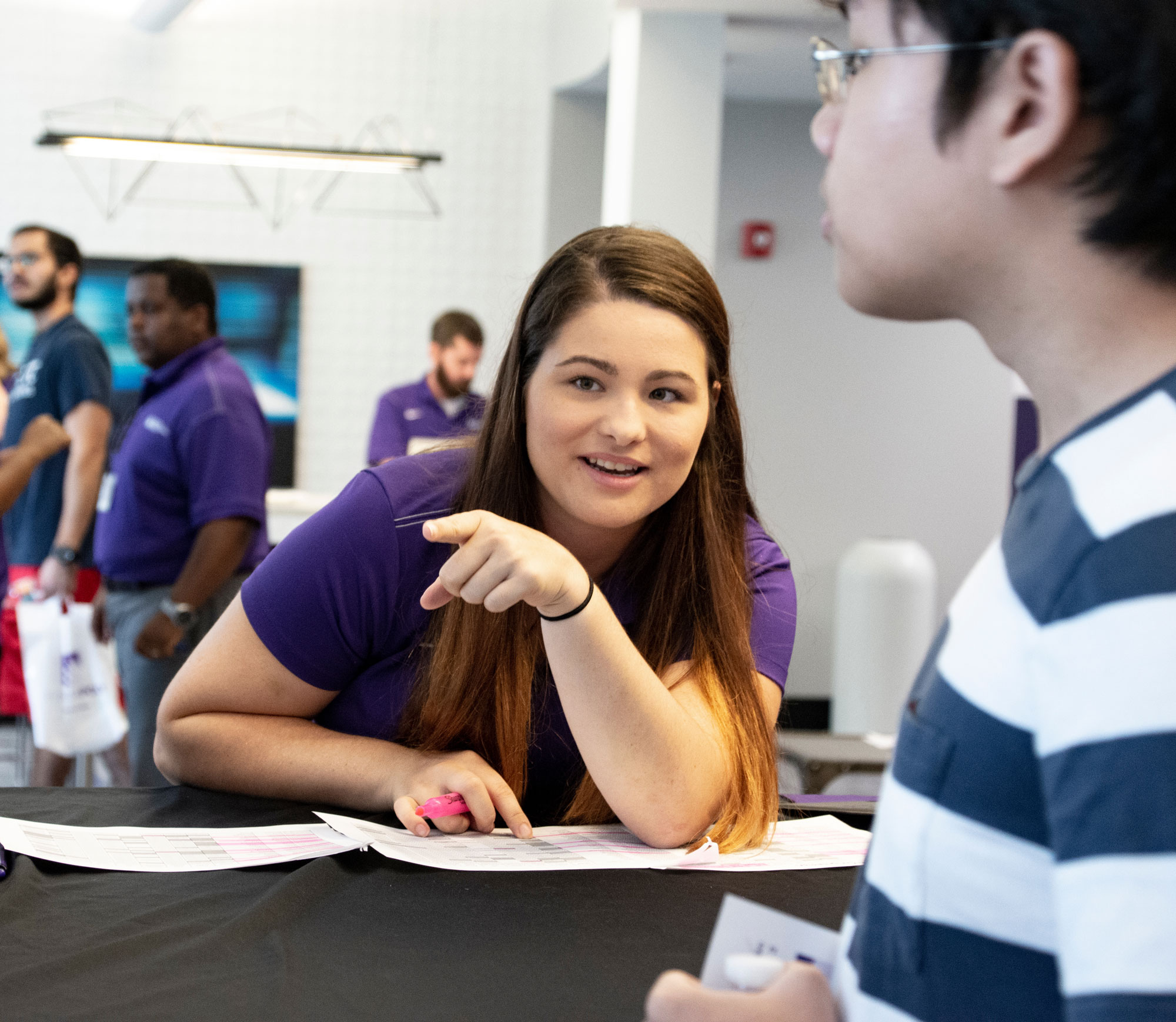 Admissions counselor working with student.