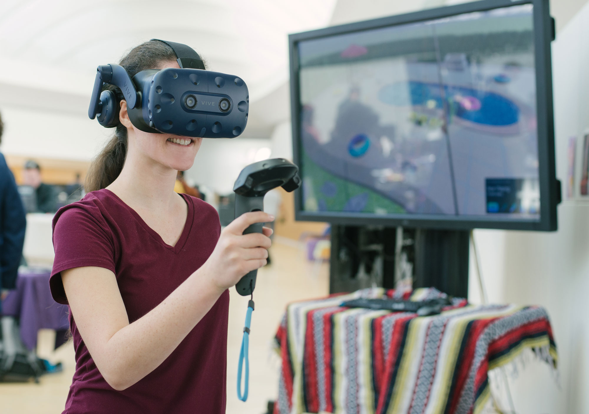 Light skinned female wearing VR goggles.