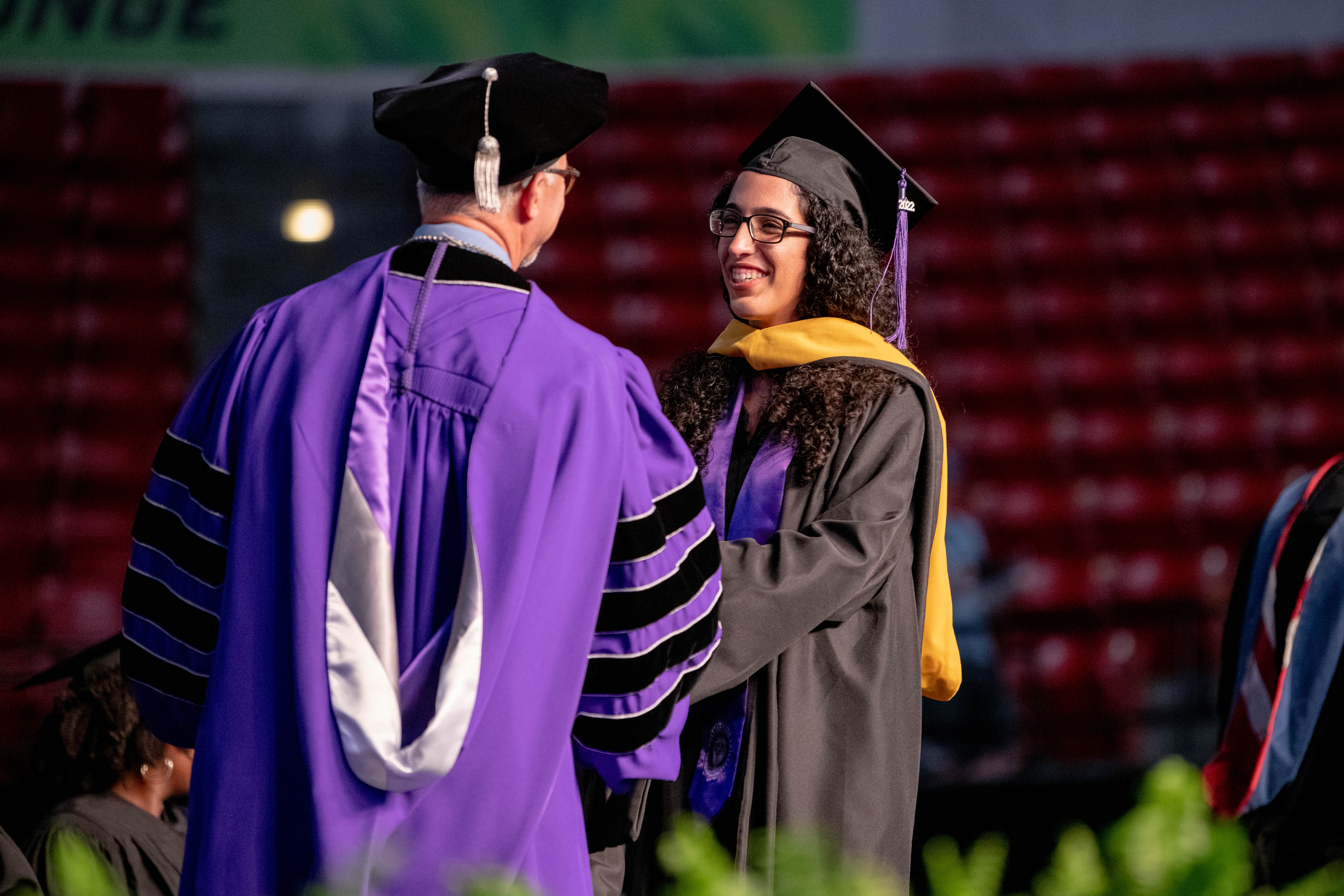 Student smiling at graduation
