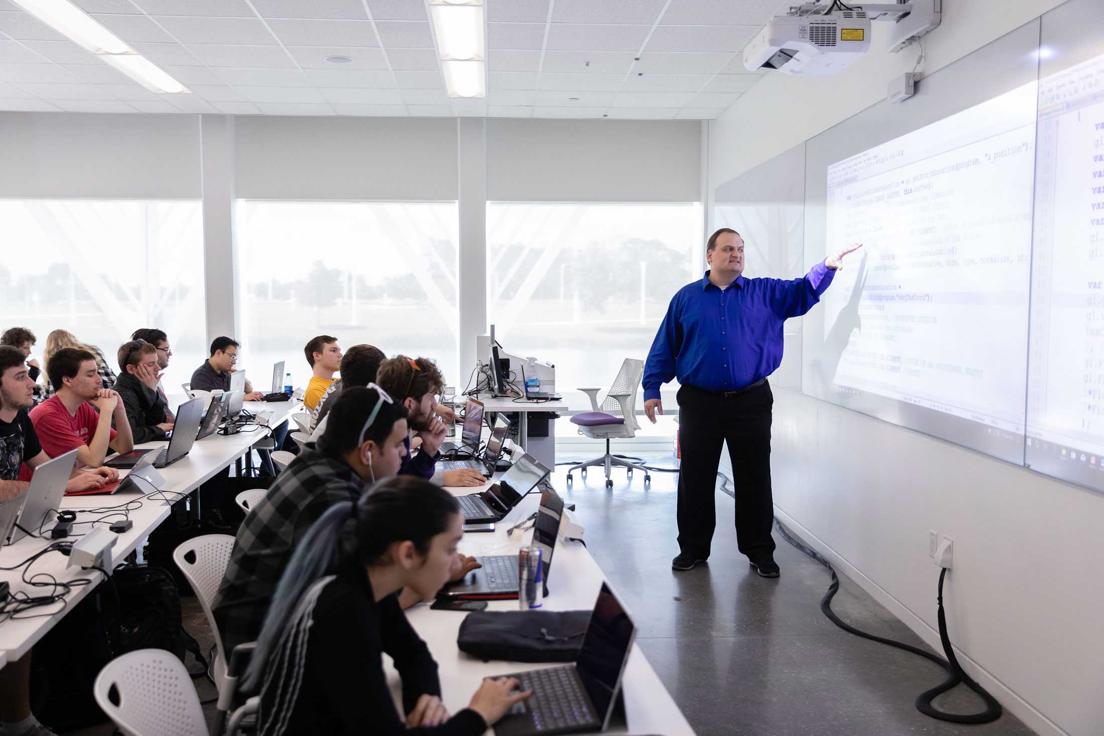 Dr. Bradford Towle, chair of the department of computer science, instructs a class inside the Innovation, Science, and Technology Building at Florida Polytechnic University.