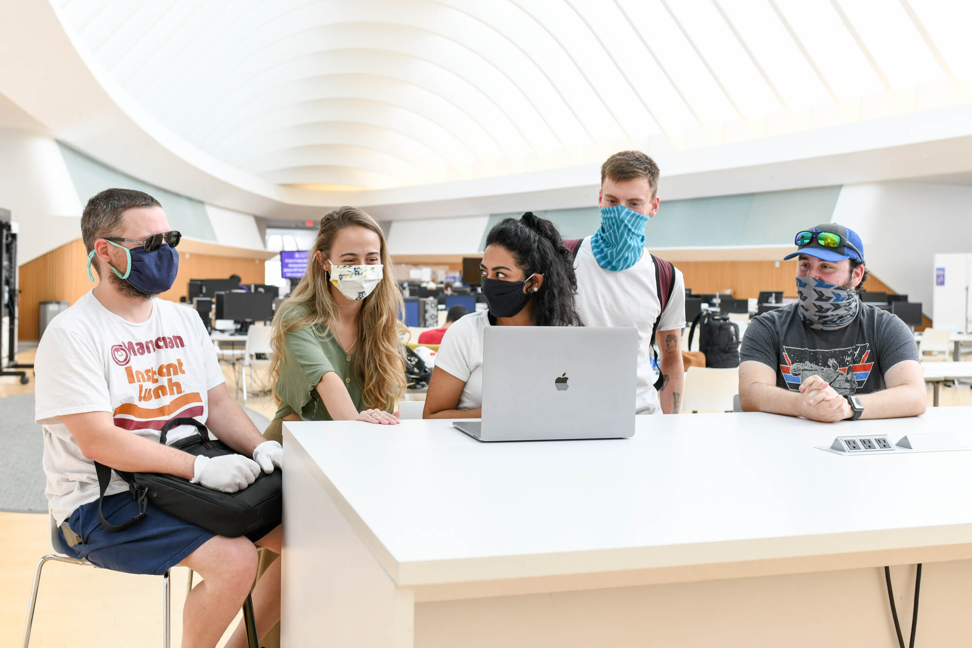 Edward Von Lue (left), Bela Rangel, Raquel Julian, Miguel Cecchini do Amaral, and Benjamin Norris are part of a team of senior capstone design students working to develop a new business risk-assessment tool. 