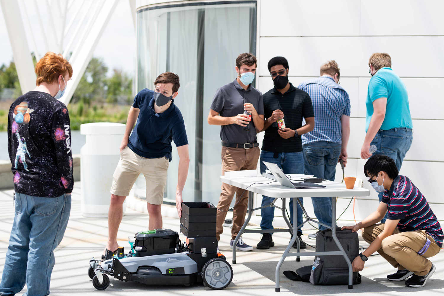 students demonstrate robotic mower