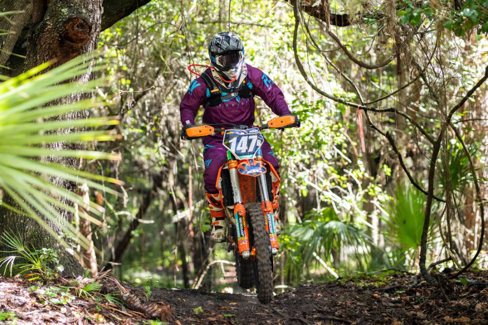 Dr. Randy K. Avent rides his KTM 350 dirt bike in Mulberry, Florida.