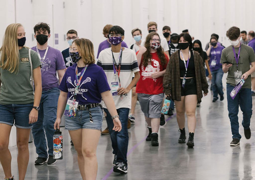 New students attending Florida Polytechnic University walk in the Innovation, Science, and Technology Building.