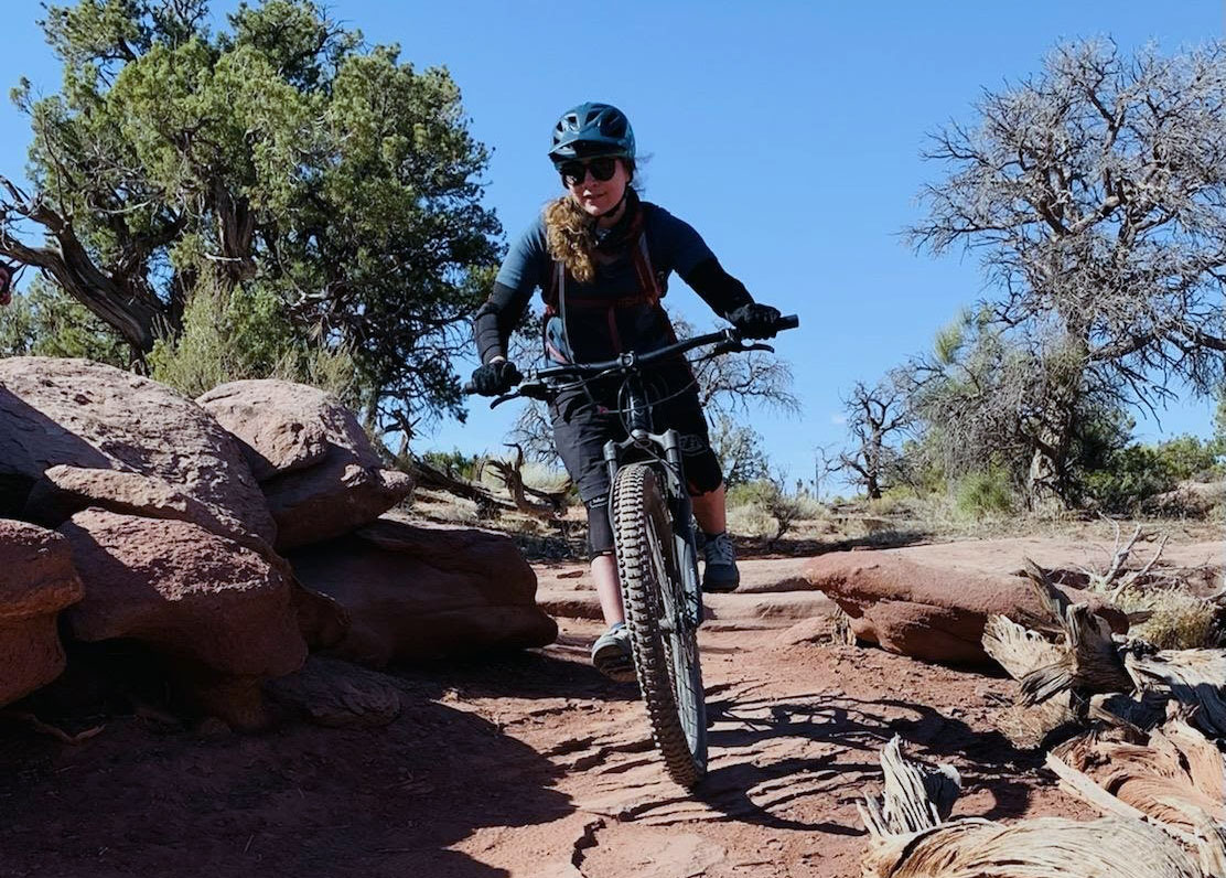 Alumna Jamie Blanco mountain bikes in Longmont, Colorado.