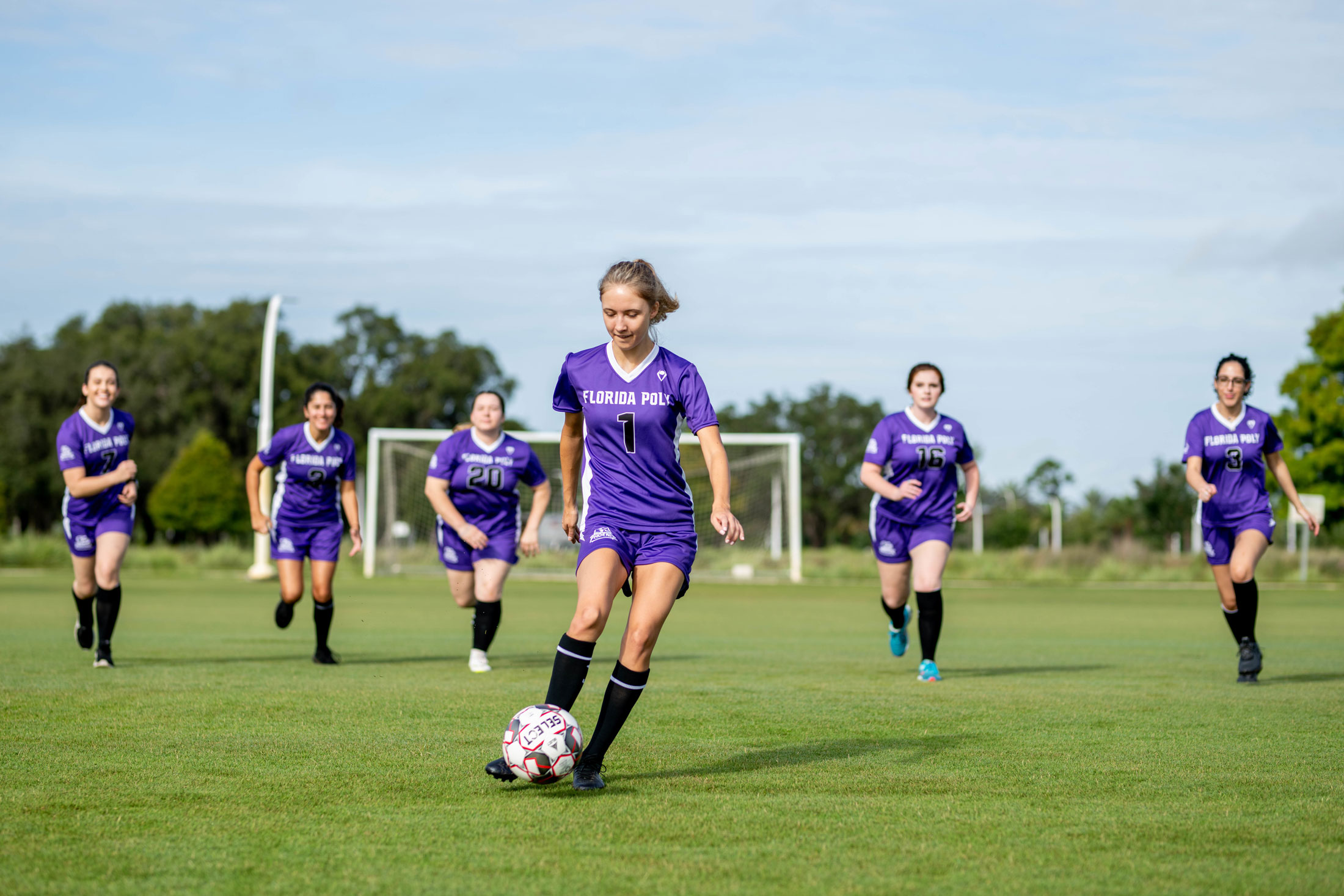 Erin Corbett works with her team on a possession drill.