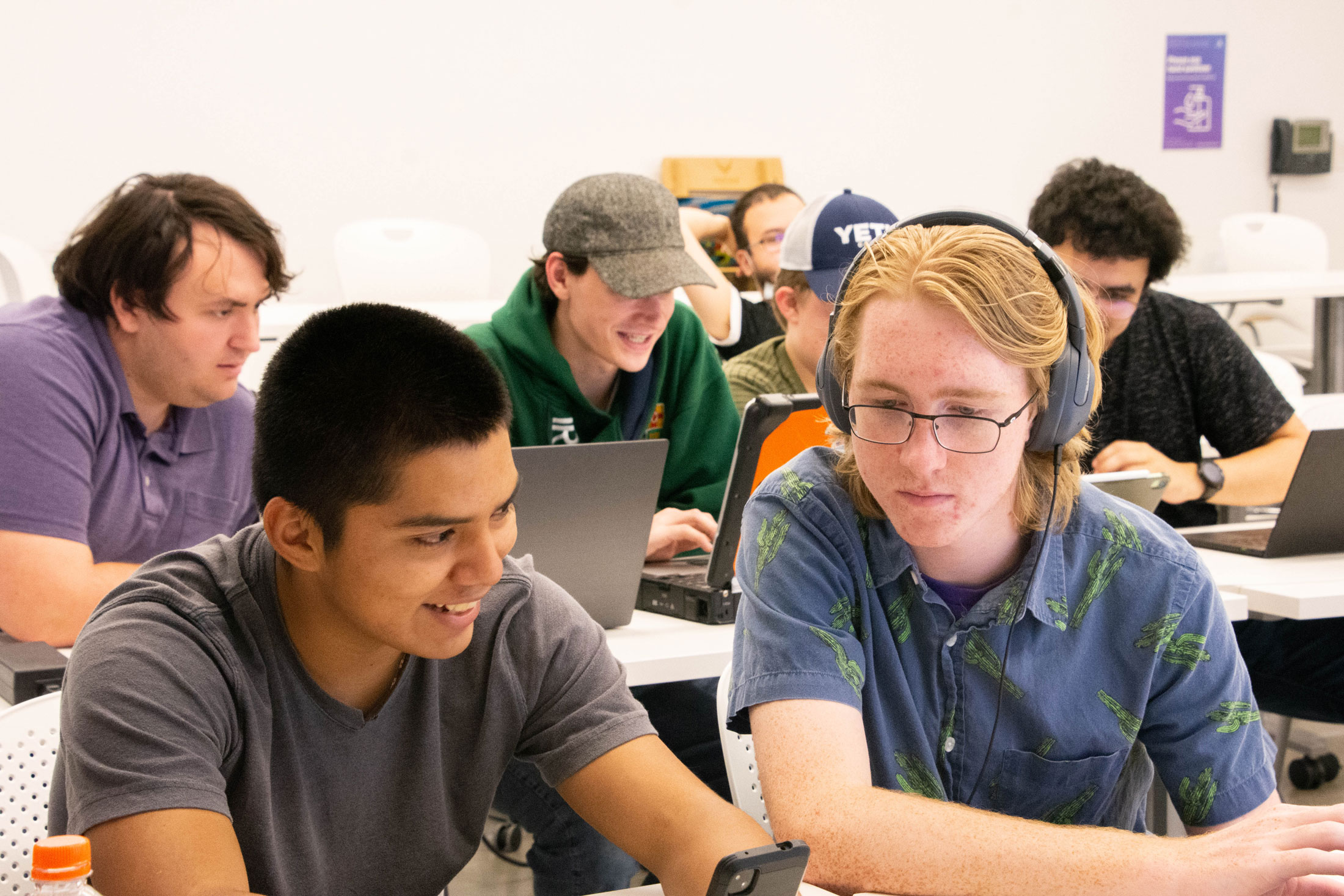 Modesto Lopez and Solomon Storts work to gain an industry certification with the Cybersecurity Club.