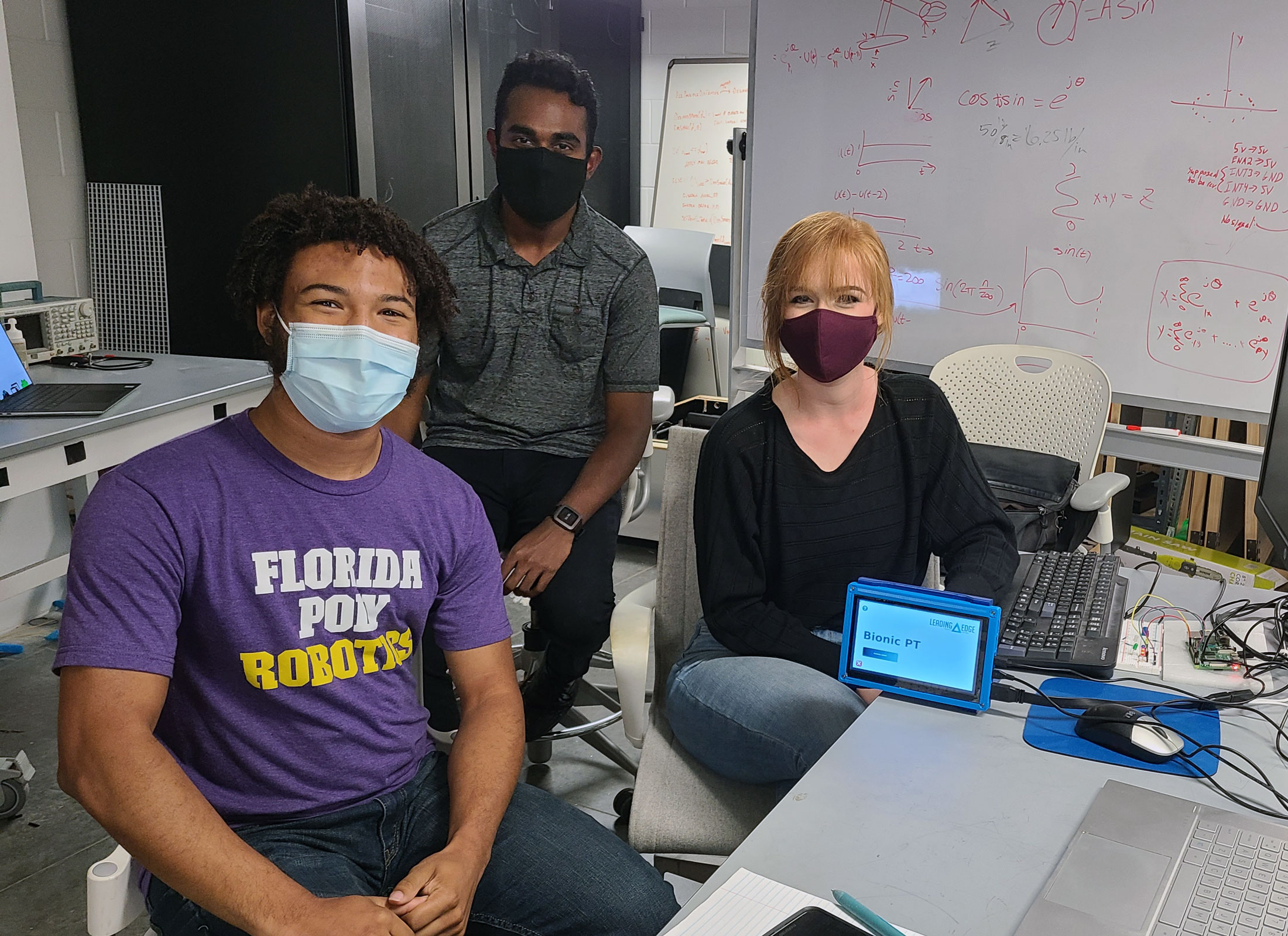 Antonio Hendricks, Kevin Racktoo, and Elisa Rexinger in the capstone lab.