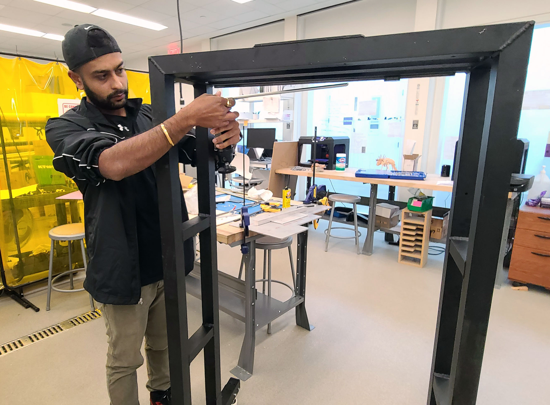 Akshad Patel works on his team's capstone project.