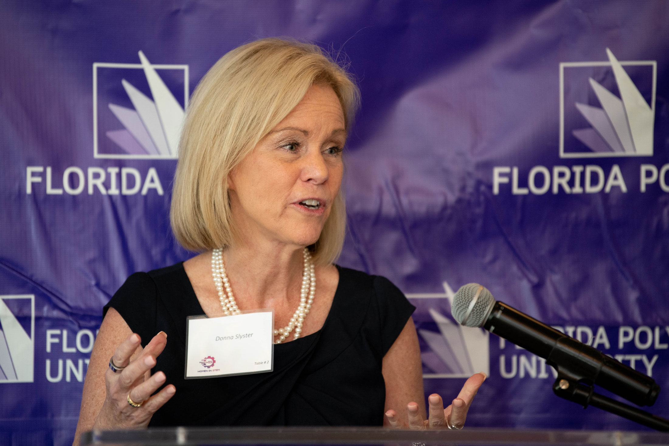 Donna Slyster speaks at Florida Polytechnic University’s Women in STEM Awards luncheon.