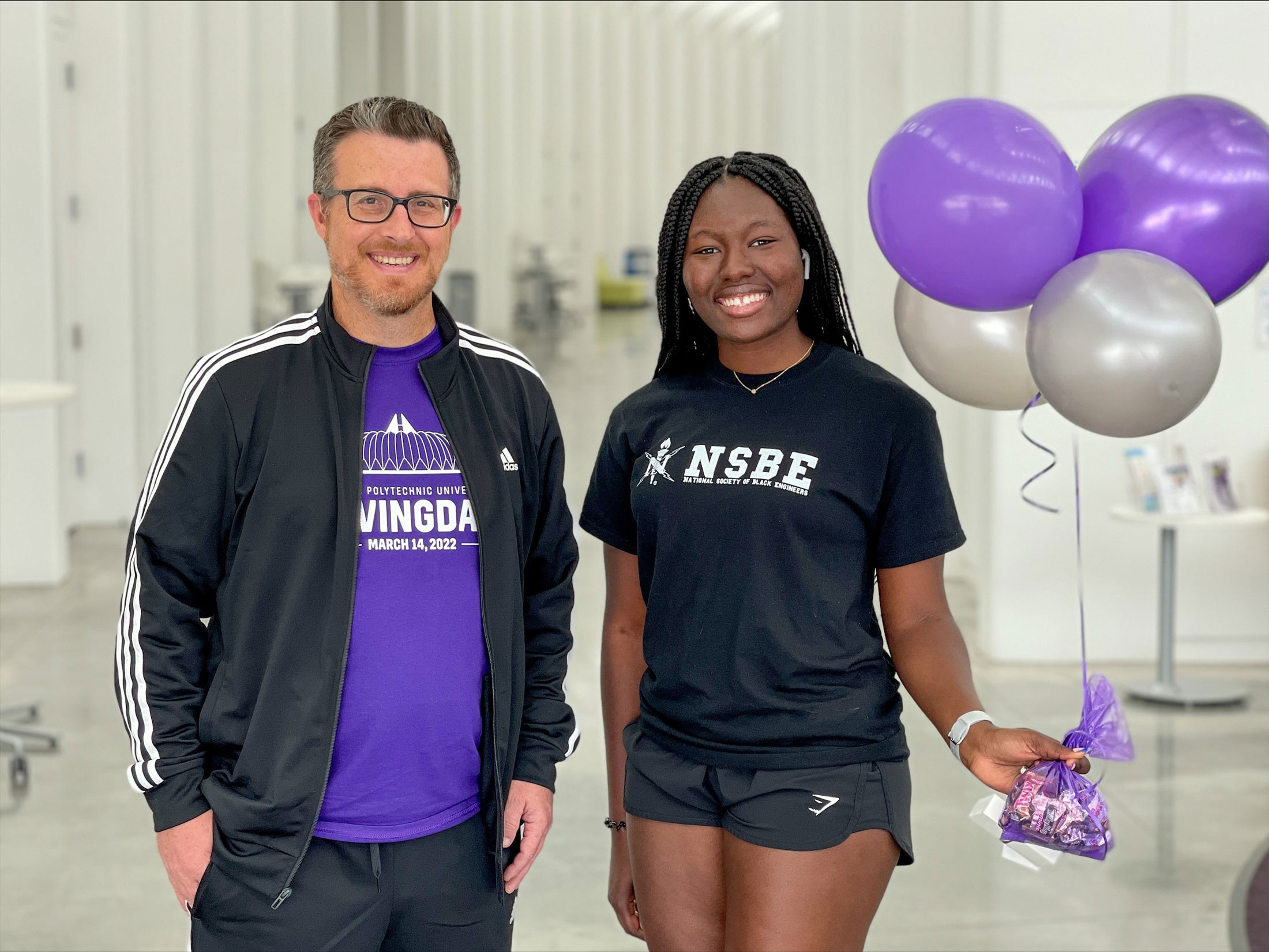 Jake Morrow, Florida Polytechnic University’s director of annual giving programs and alumni relations, and Catherine Abraham, National Society of Black Engineers president.