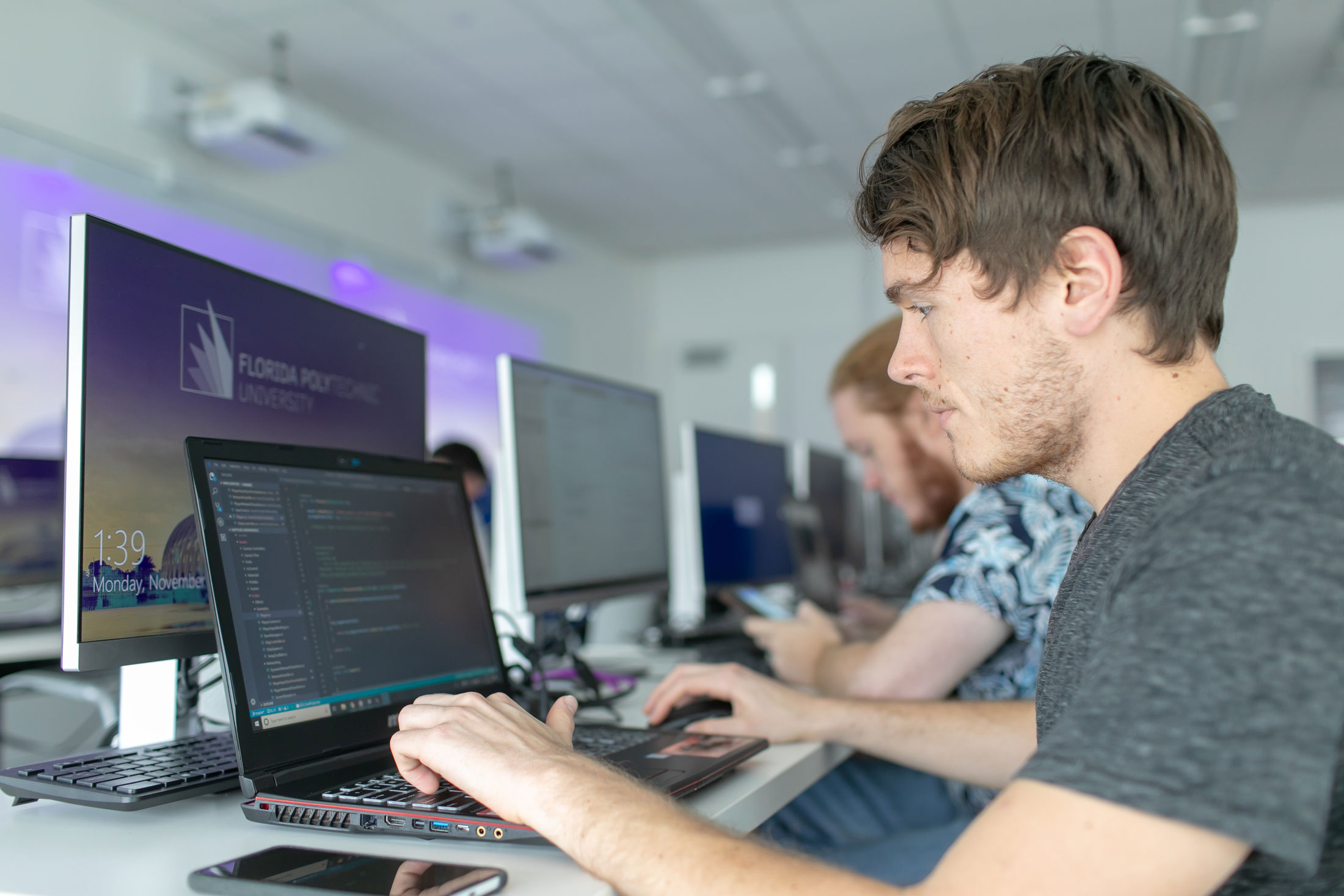 A student works at a computer.