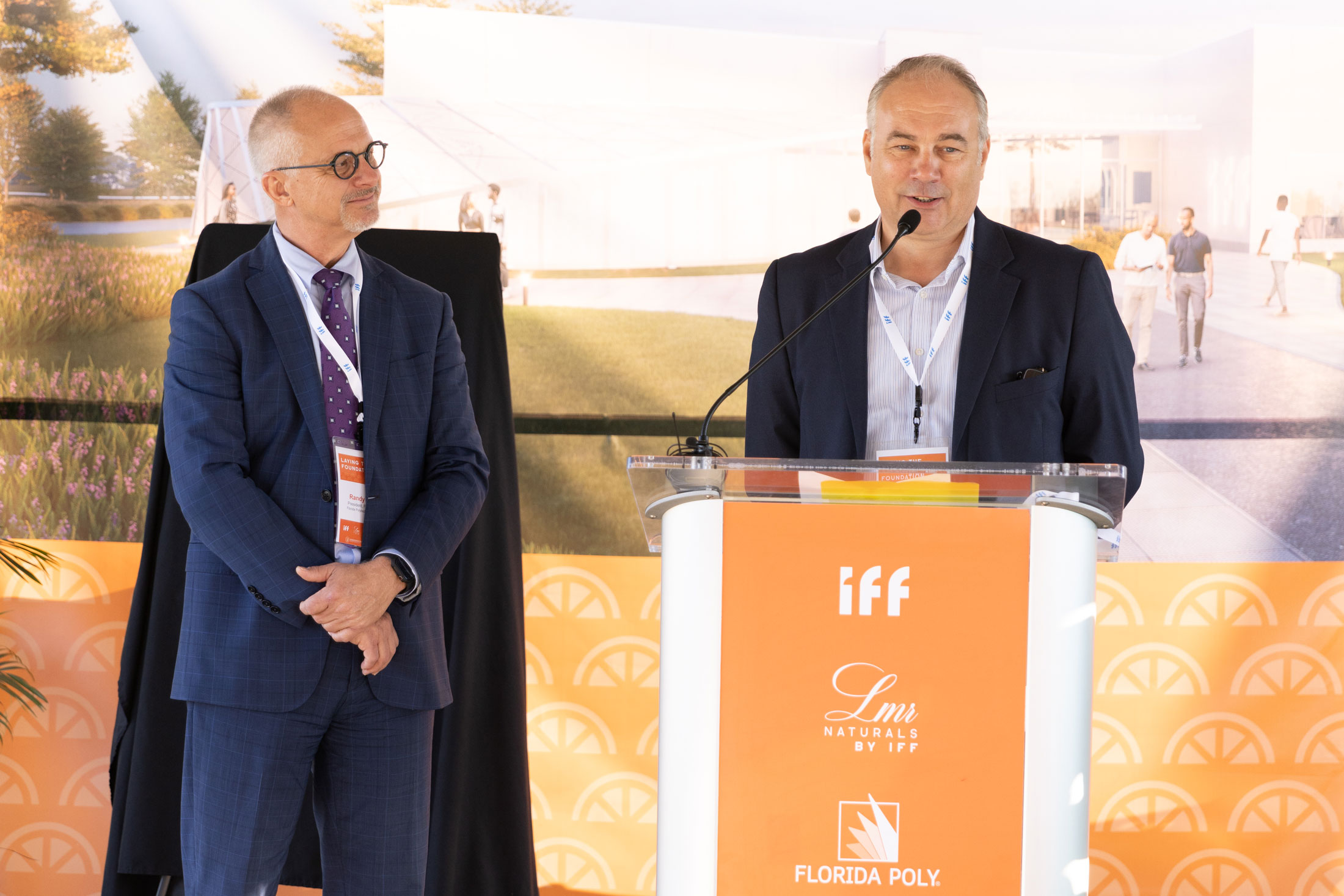 Karel Coosemans, global innovation program director for IFF, presents Florida Polytechnic University President Randy K. Avent a gift of $125K for scholarships and a new research fund.