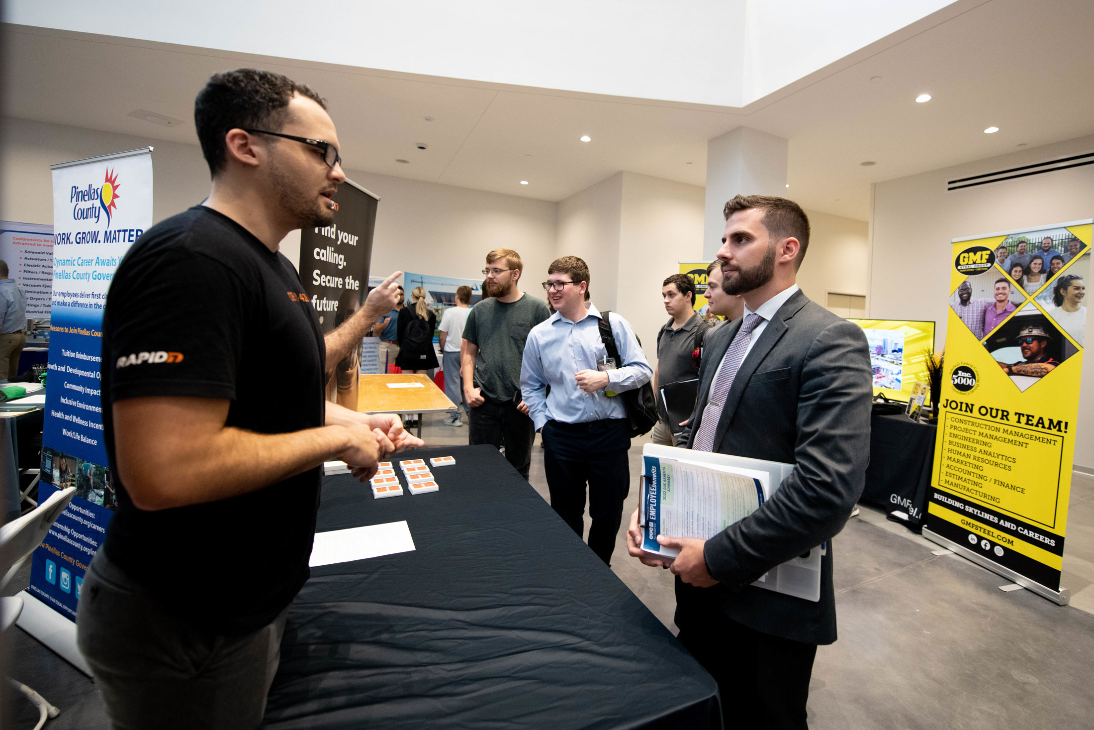 A Florida Poly student meets with a company representative at the fall 2022 career fair.