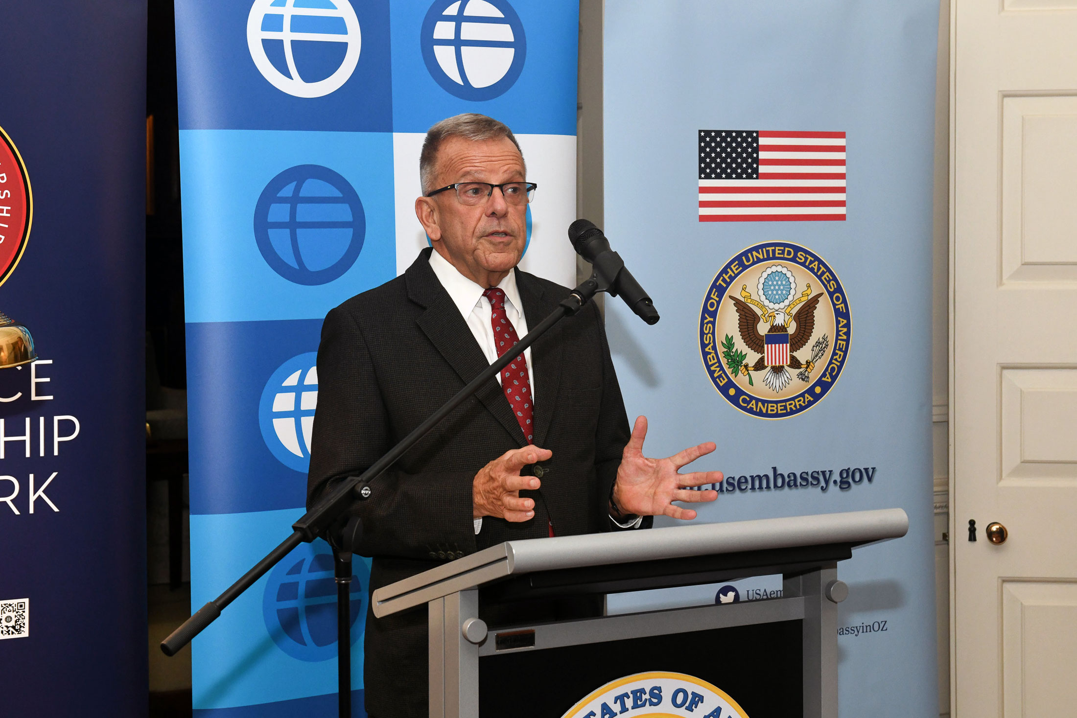 Thomas Dougherty speaking at a podium