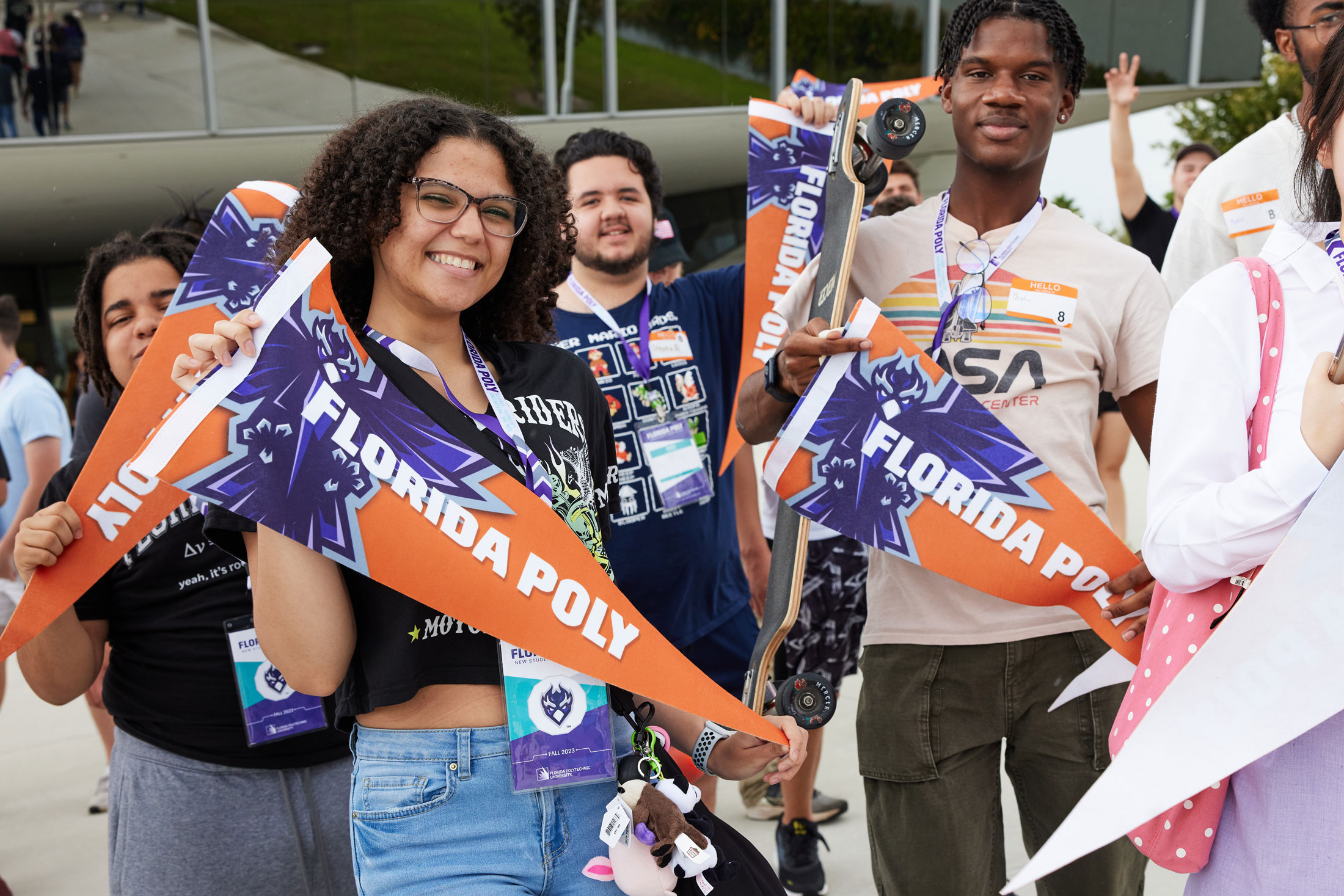Florida Poly students show off their University pennants. 