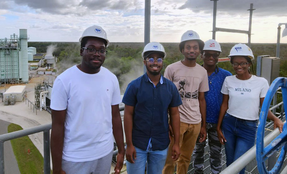 Students Wenslo Dort (left), Justin Henry, Joseph Williams, Abohfu Anumoh, and Arianna Pierre at the Kissimmee Utility Authority power plant.