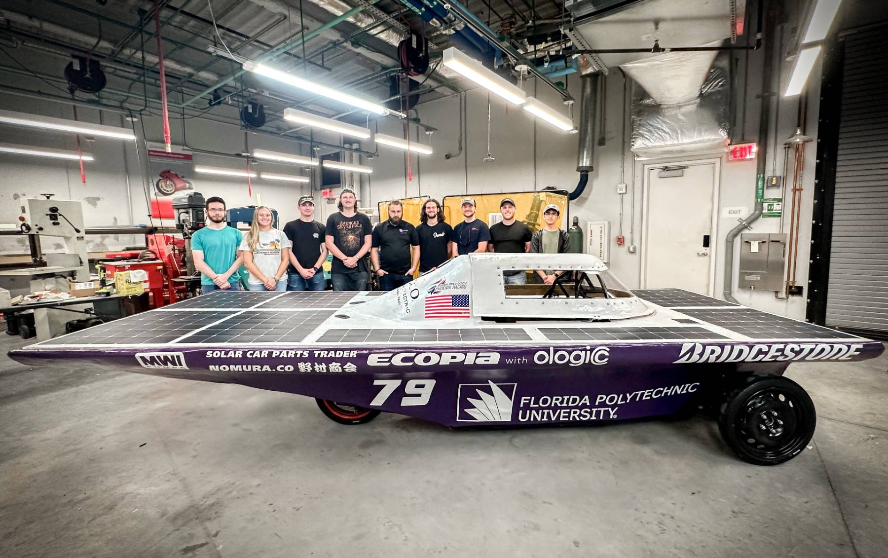 Phoenix Racing Team stands with the solar race car