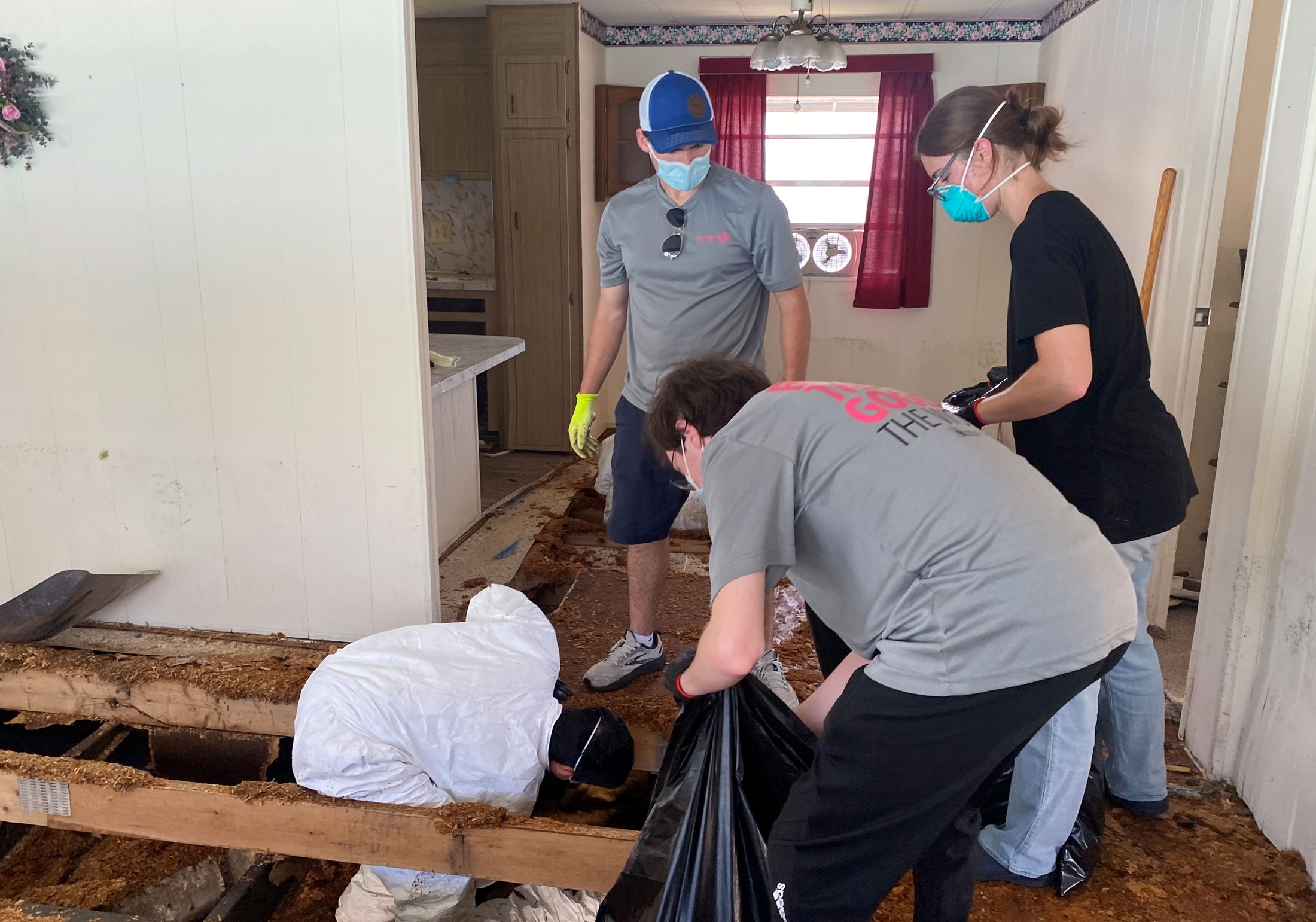 Rotaract Club members help with hurricane recovery.