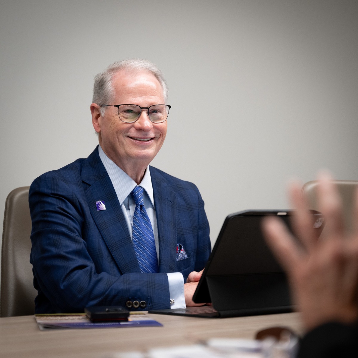 President Stephenson sitting at computer