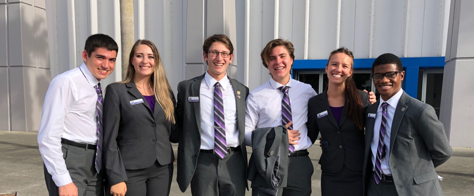presidential ambassadors in front of building