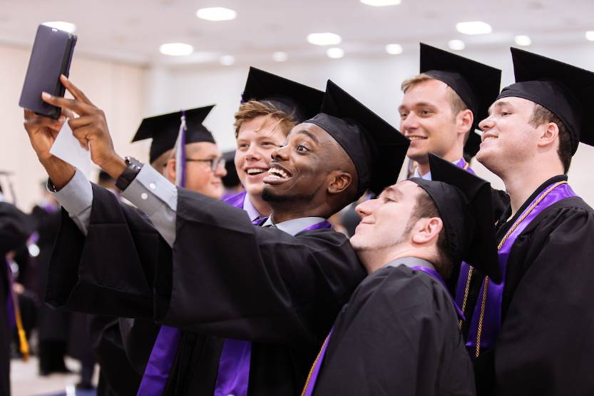 graduates taking a selfie