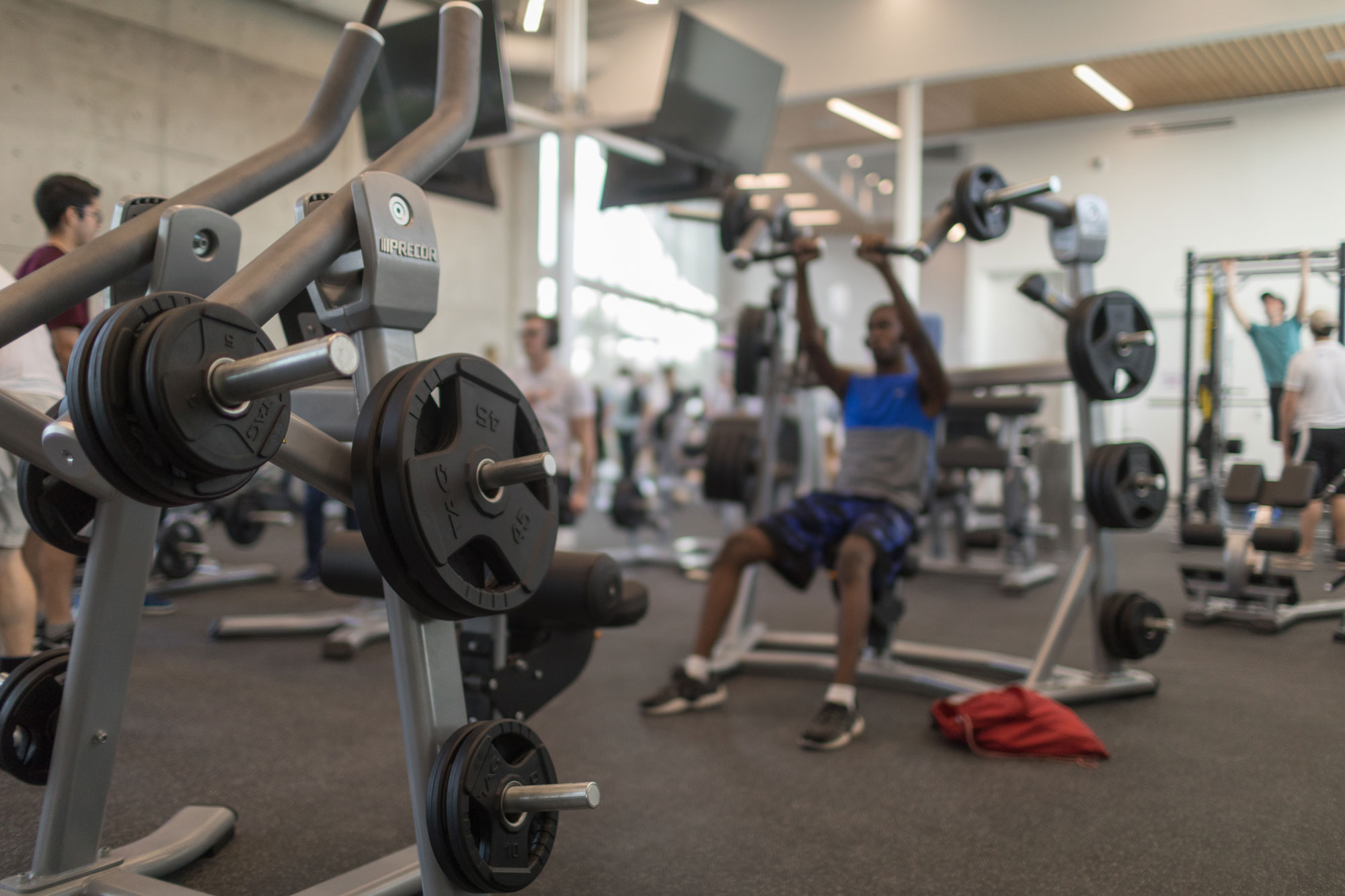 Student lifting weights