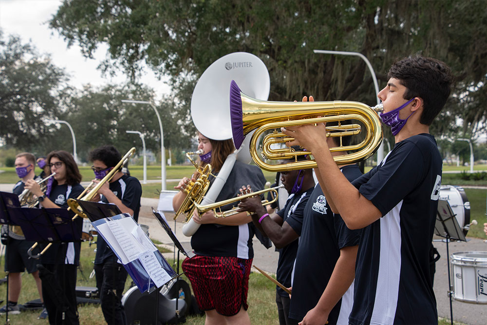 four band members with their instruments