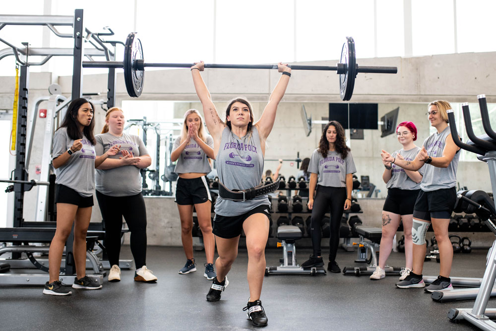 team captain madi yonash with womens powerlifting team