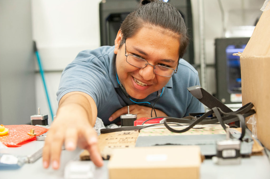 Senior Andres Regalado is leading a student project to build a 3D printer from scratch in the Rapid Application Development (RAD) MakerSpace lab at Florida Polytechnic University.