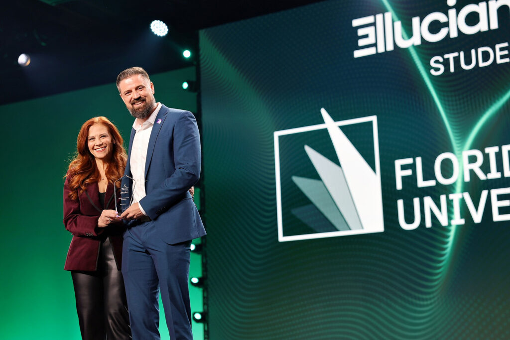 Florida Poly VP Cole Allen receives 2026 Ellucian Impact Award from Ellucian executive Christi Segal.