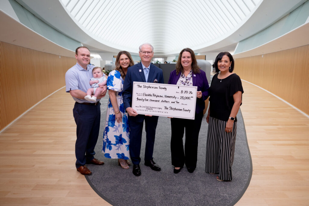 Dr. Devin Stephenson presents a $25,000 check to the Florida Poly Foundation in memory of his late wife, Judy Stephenson.
