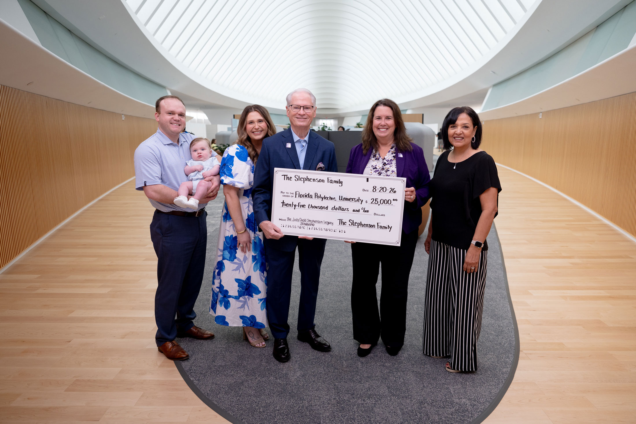 Dr. Devin Stephenson presents a $25,000 check to the Florida Poly Foundation in memory of his late wife, Judy Stephenson.
