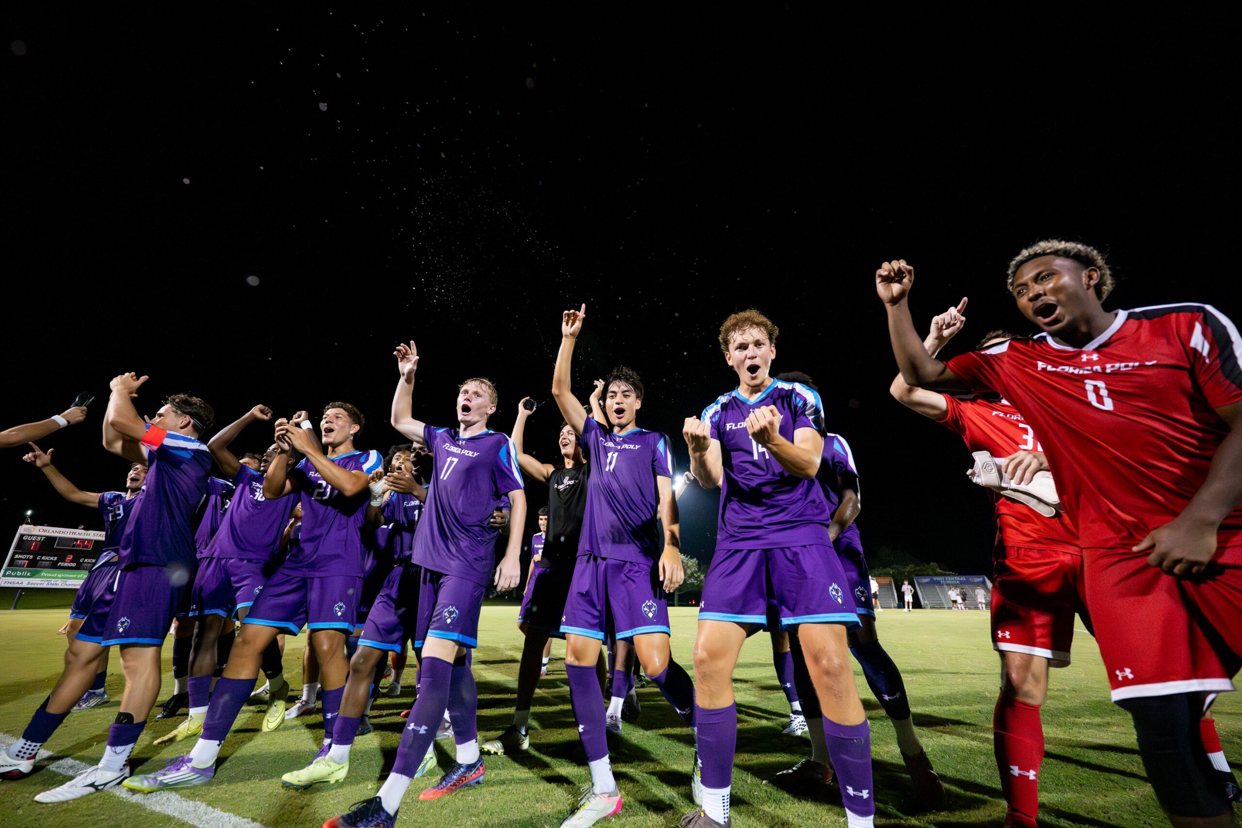 The Florida Poly men’s soccer team celebrates with fans after the Phoenix’s 4-0 win the Lake Myrtle Sports Complex.