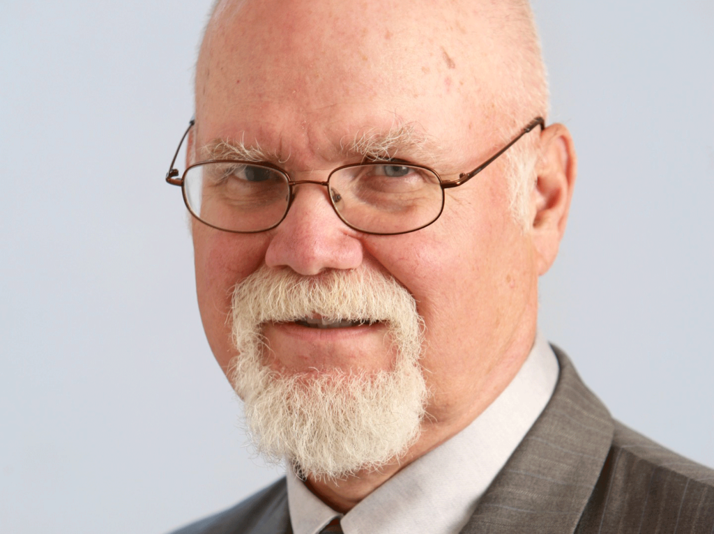 Pale skinned male with glasses.