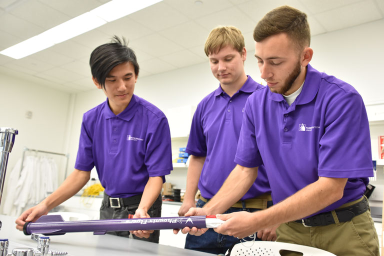 Eric Chan (left), Patrick Mahoney (center) and Brent Collins are part of a six-member Florida Poly team called the Phoenix Flyers, which will compete in a statewide rocket launch competition sponsored by NASA’s Florida Space Grant Consortium.